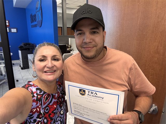 A TRA Academy student with their course certificate of completion and instructor Nora Acosta